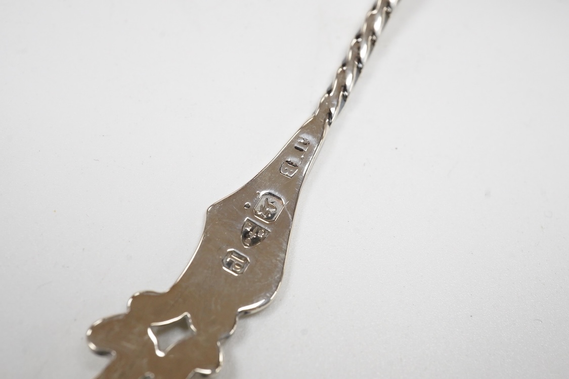 Small silver and white metal, including an Edwardian silver tea strainer, import marks for London, 1908, 15.7cm, a late Victorian silver sifter spoon, silver handled scissors with case, a white metal corkscrew and a whit